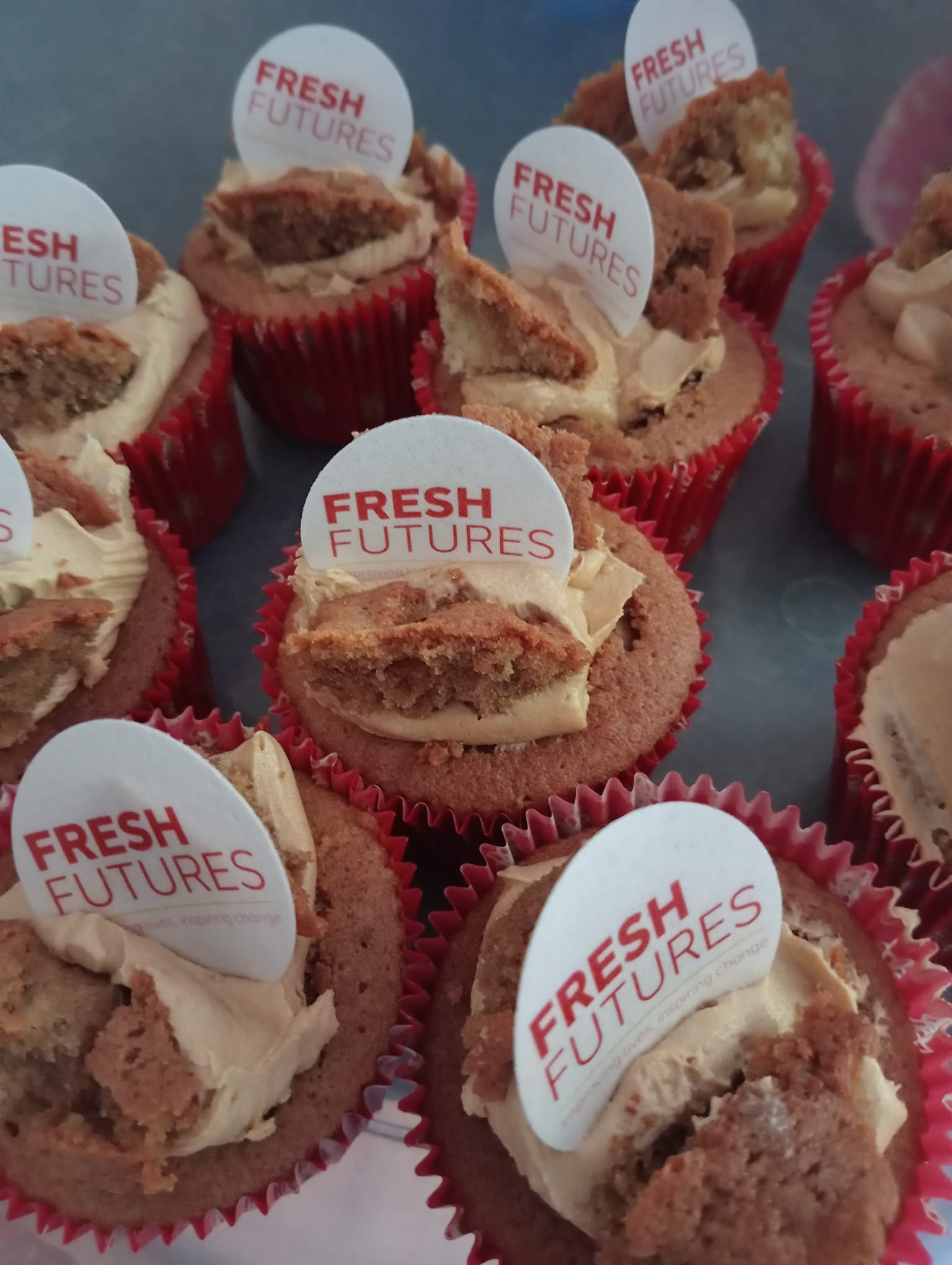 Butterfly bins decorated with Fresh Futures icing labels on top. 