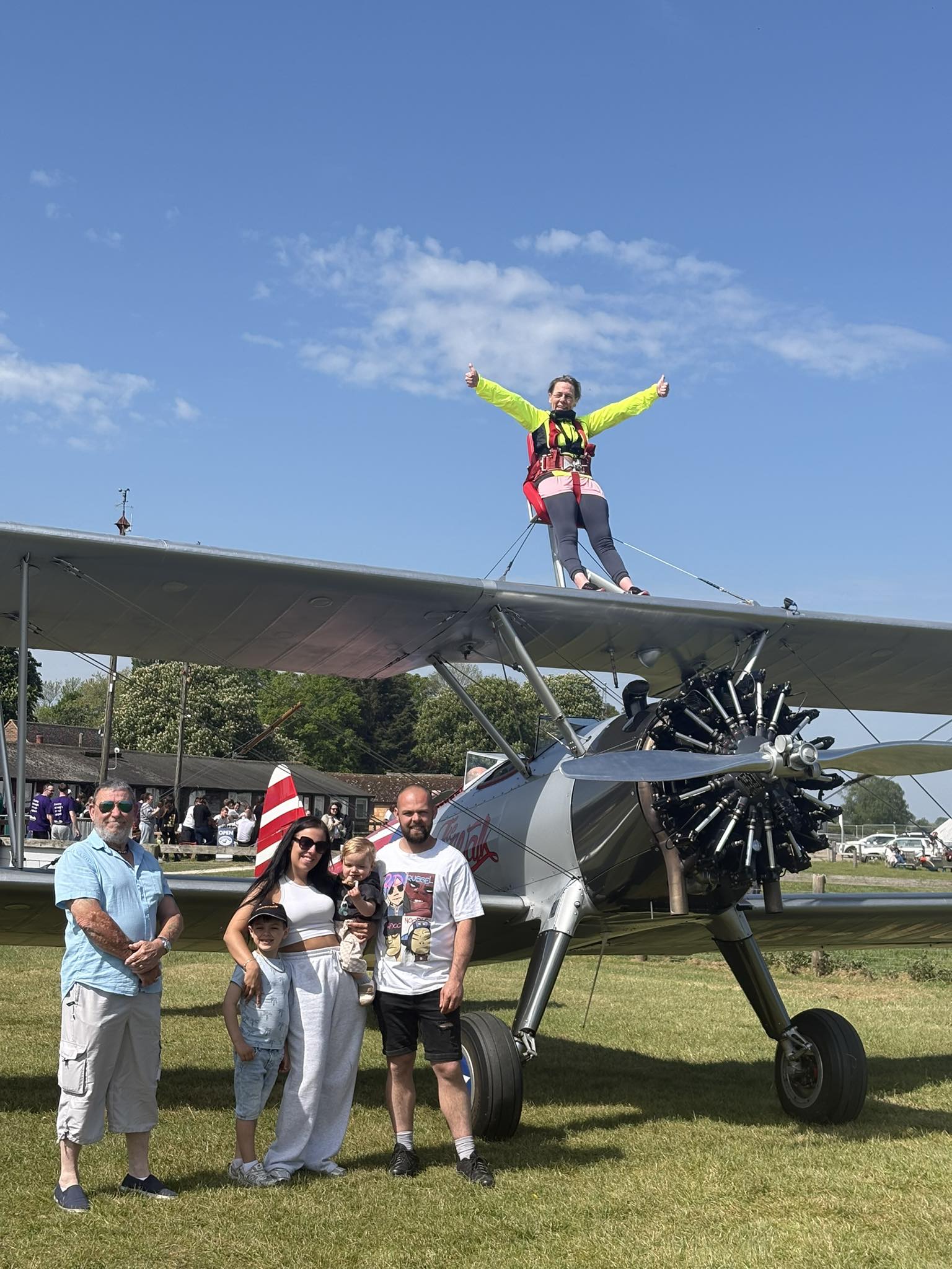 Terri's Wing Walk - picture with her family and Terri on top of plane