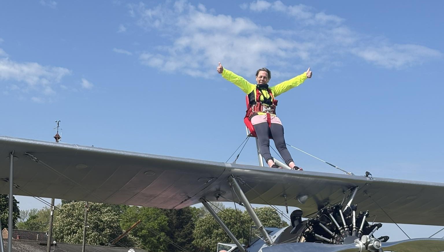 Terri on top of the plane for her Wing walk for charity