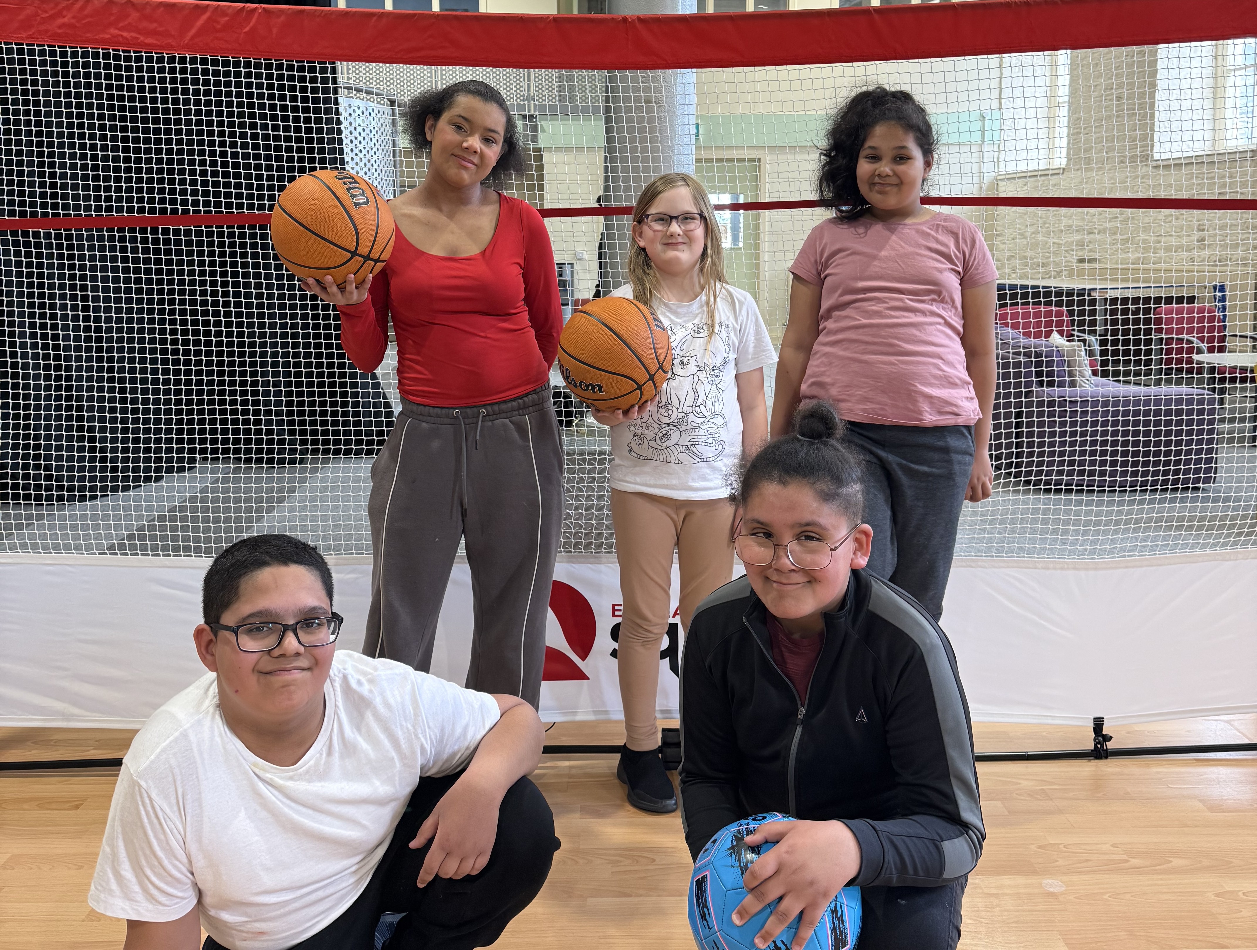 children playing basketball at the out-of-school club