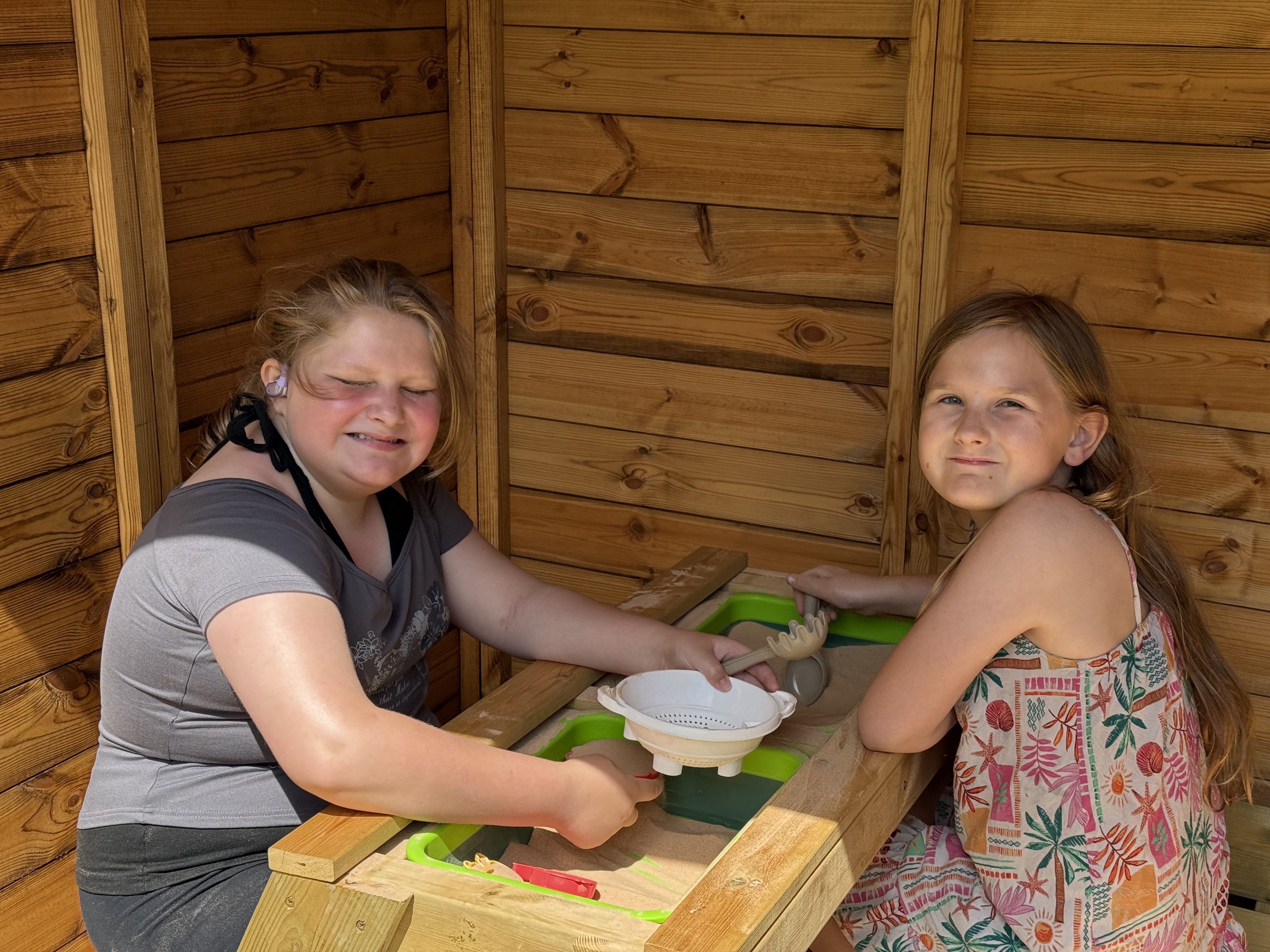 Garden Children playing with sandpit