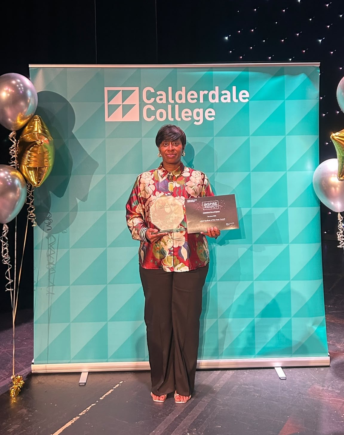 Deonne at the awards ceremony with her adult student of the year award