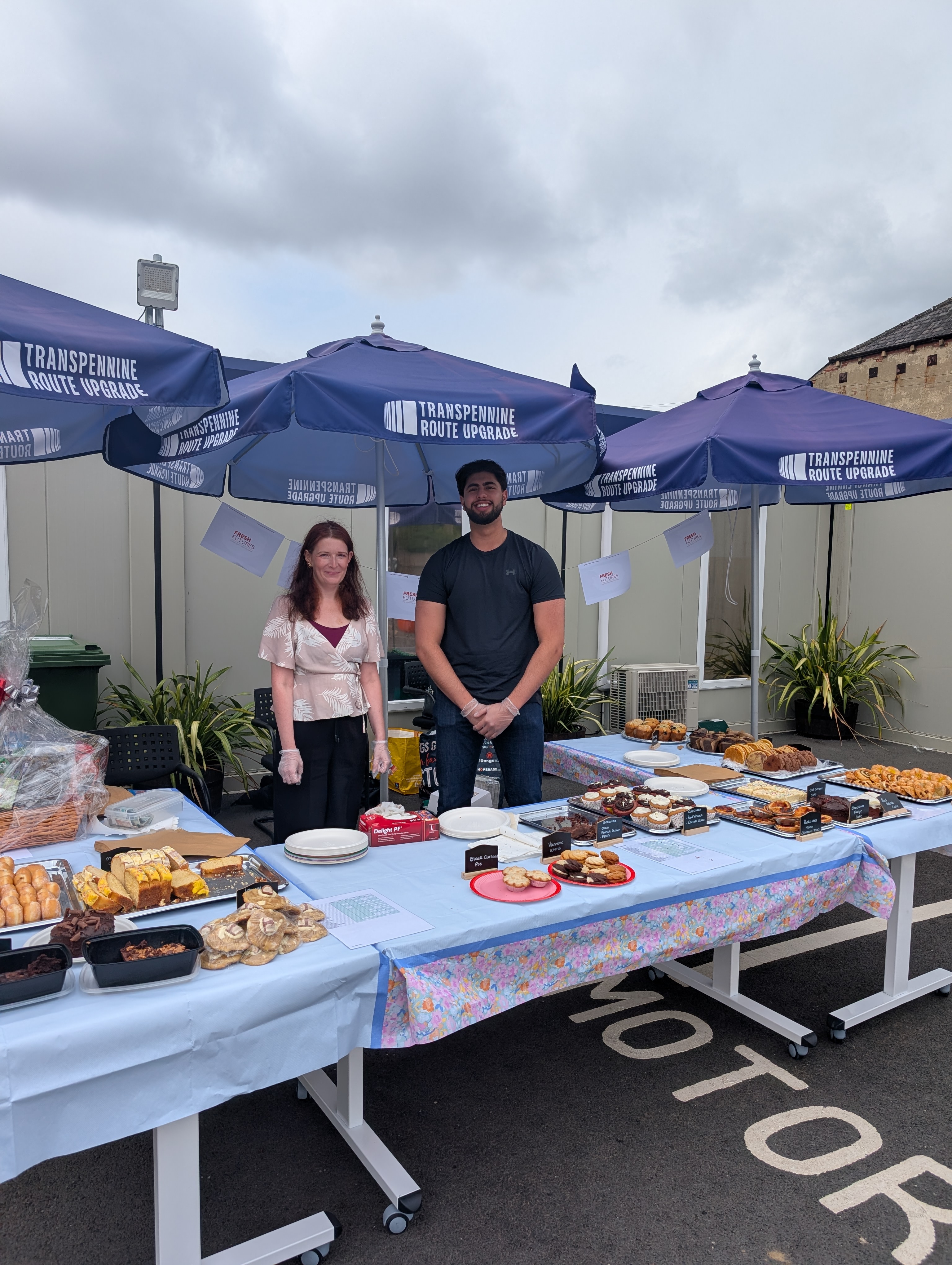 picture 2 people from TRU (The Route Upgrade) hosting their own Coffee morning offsite to raise money for Fresh Futures