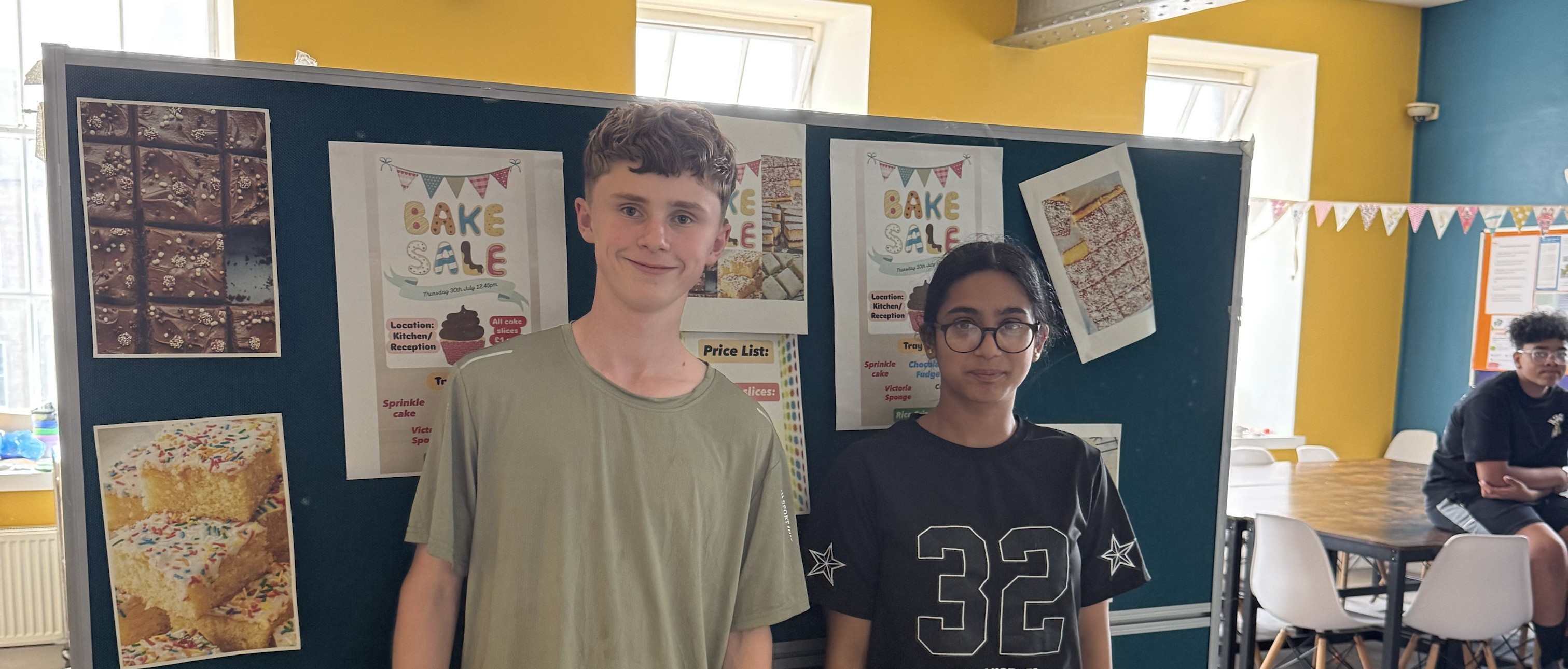 2 Out of school Club children at serving at bake sale